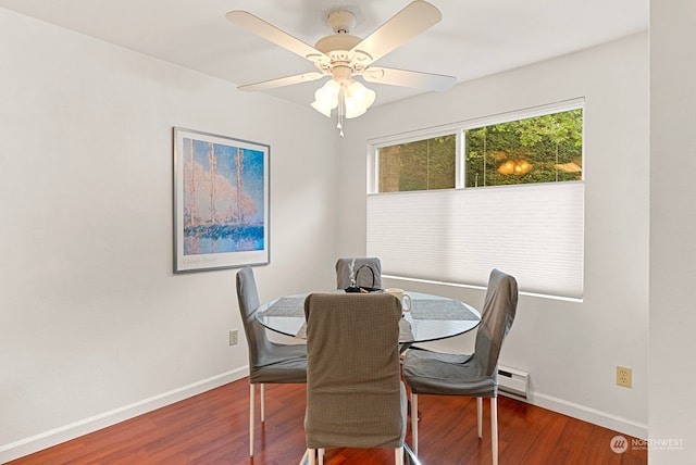 dining area with ceiling fan and dark hardwood / wood-style flooring