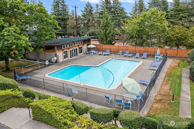 view of swimming pool featuring a patio area