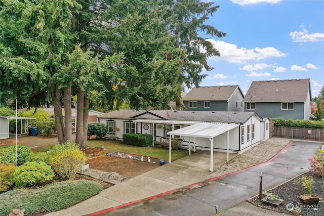 5250 College St SE Unit 18, Lacey, WA 98503 - exterior space featuring concrete driveway, fence, and a carport