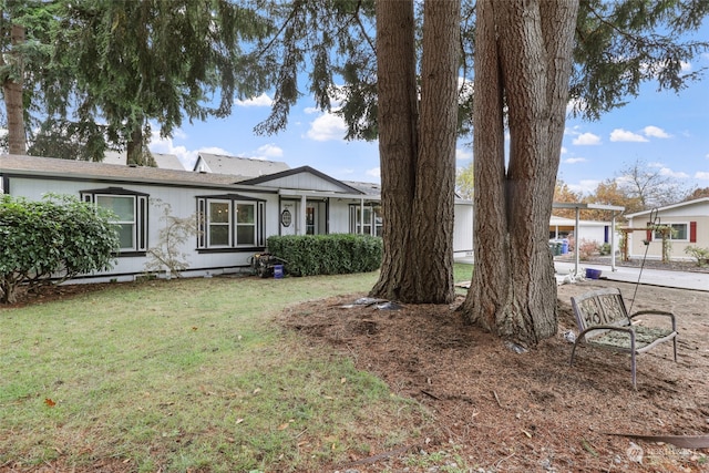 single story home with a garage and a front lawn