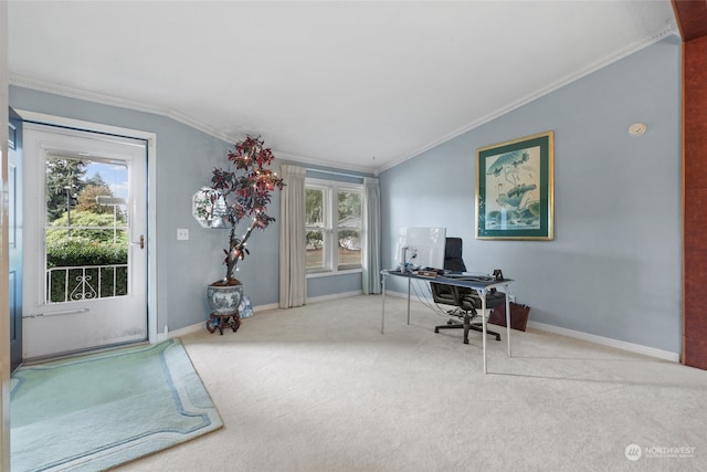 carpeted office space featuring a healthy amount of sunlight, ornamental molding, and vaulted ceiling