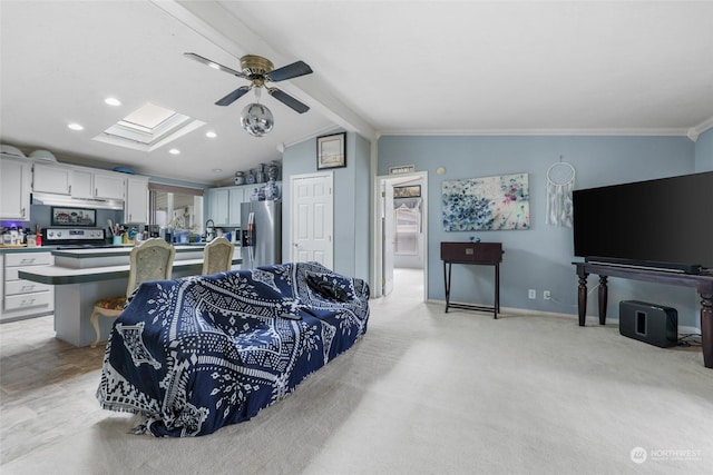 5250 College St SE Unit 18, Lacey, WA 98503 - living area with vaulted ceiling with skylight, recessed lighting, crown molding, a ceiling fan, and baseboards