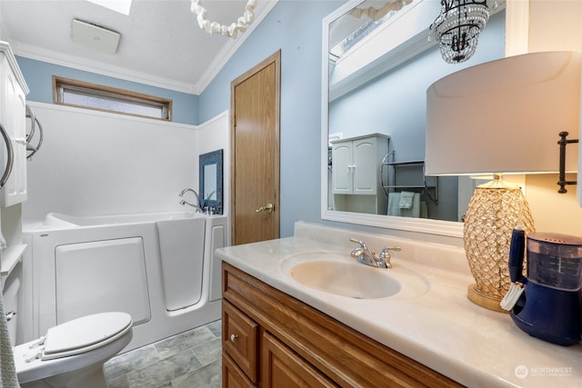 bathroom with toilet, crown molding, vaulted ceiling with skylight, an inviting chandelier, and vanity