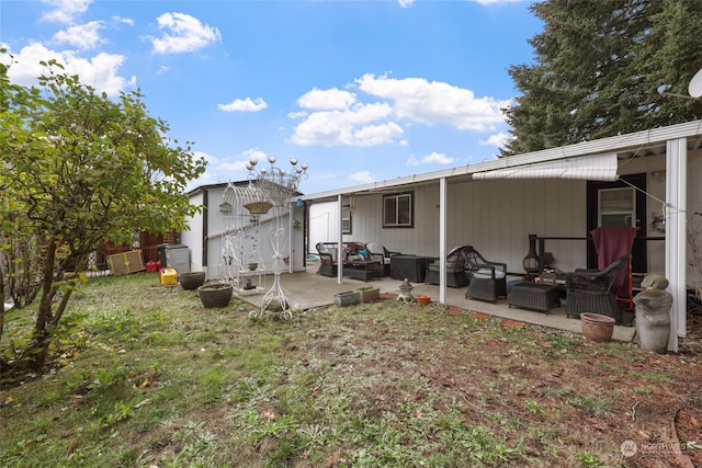 rear view of house featuring a patio and an outdoor hangout area