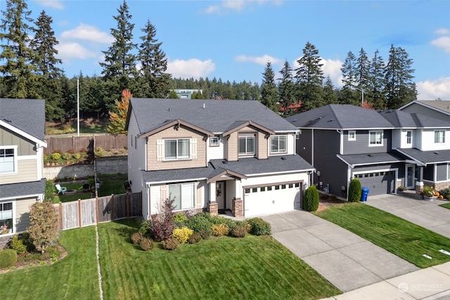 view of front of home with a front lawn and a garage