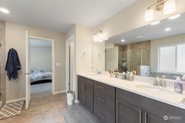 bathroom with a shower with door and vanity