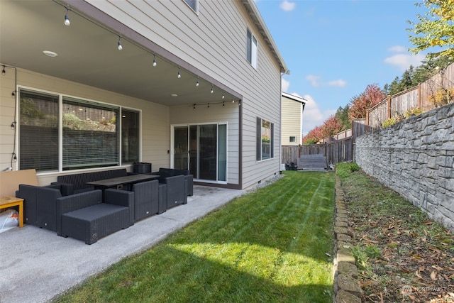 exterior space with an outdoor hangout area and a patio area