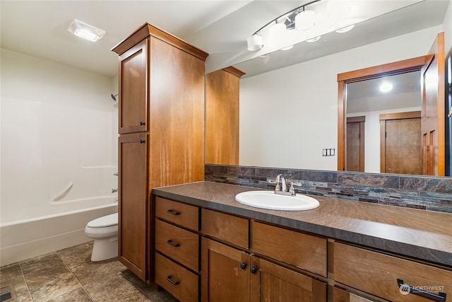 full bathroom featuring vanity, shower / bathtub combination, and toilet