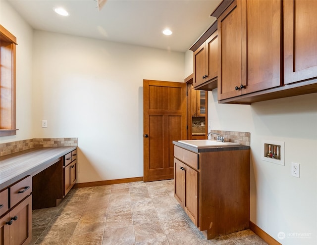 kitchen featuring backsplash and sink