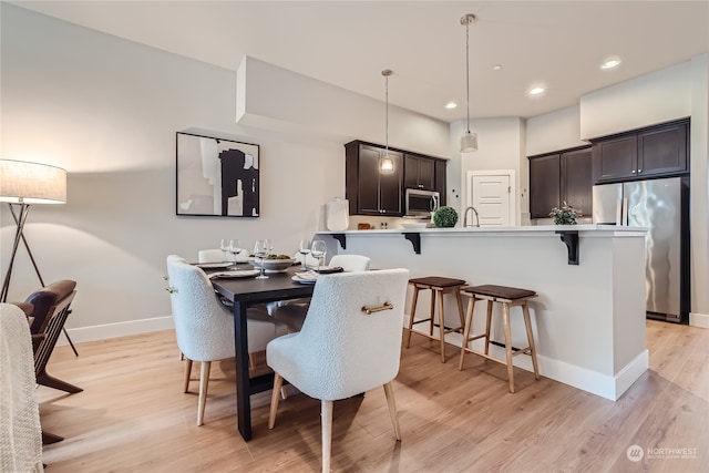 dining space featuring light hardwood / wood-style flooring