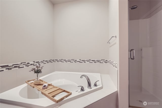 bathroom with shower with separate bathtub