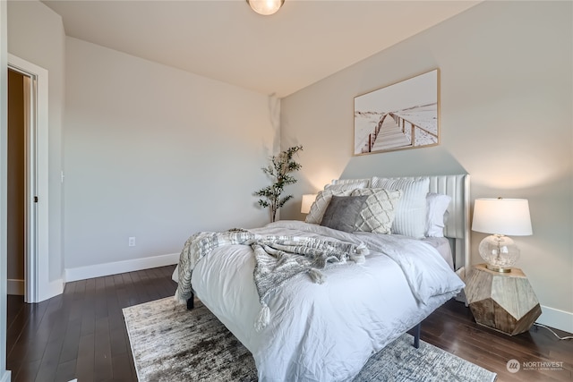 bedroom featuring dark hardwood / wood-style flooring