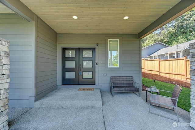 property entrance featuring a patio area