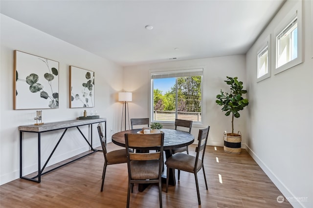 dining area featuring hardwood / wood-style floors