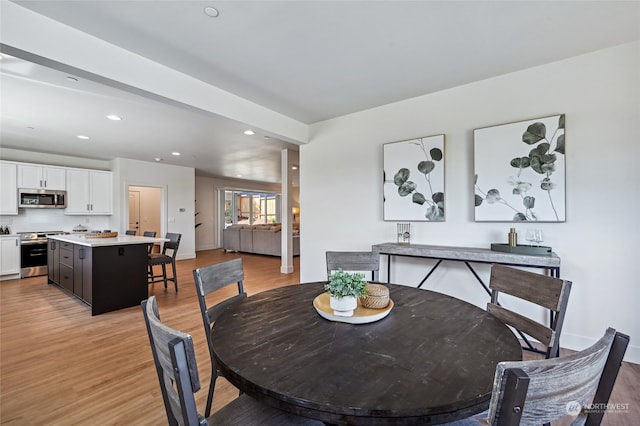 dining area with light hardwood / wood-style flooring