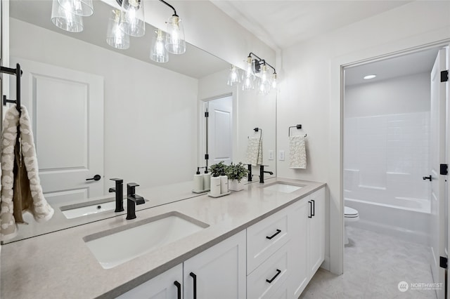 bathroom with toilet and vanity