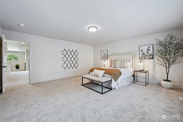 bedroom featuring light colored carpet