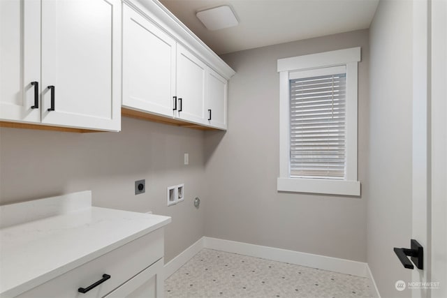 laundry area with cabinets, hookup for an electric dryer, and washer hookup