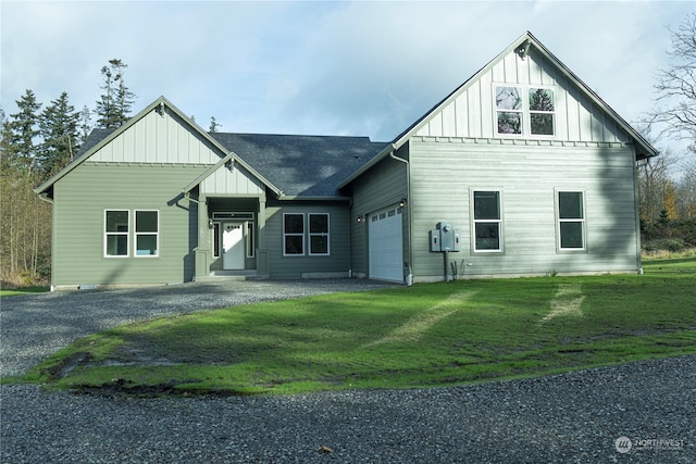 modern inspired farmhouse with a garage and a front yard