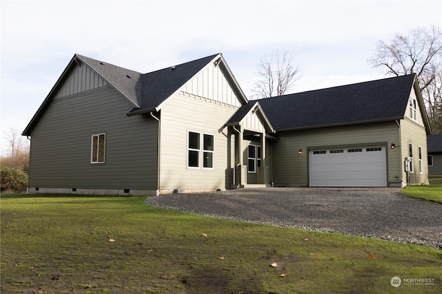 view of front of home with a garage and a front yard