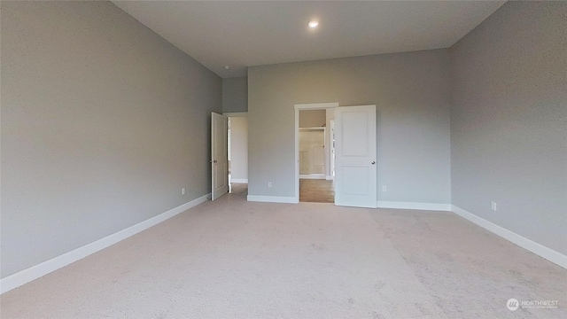 unfurnished bedroom with light carpet