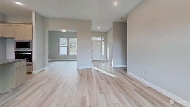 unfurnished living room with light hardwood / wood-style flooring