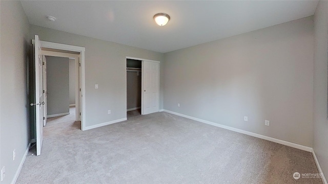 unfurnished bedroom with a closet