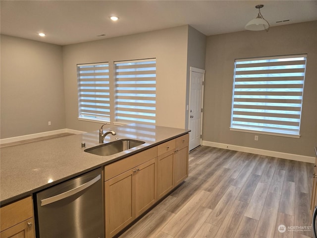 kitchen with sink, light hardwood / wood-style flooring, dishwasher, hanging light fixtures, and light brown cabinets