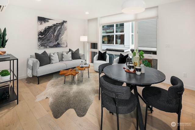 dining space with light hardwood / wood-style flooring