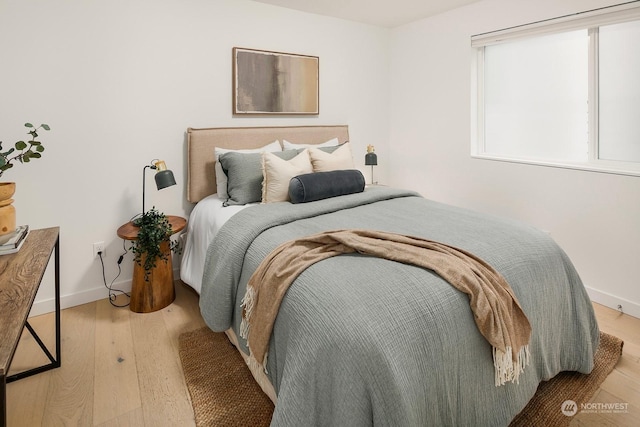 bedroom featuring light wood-type flooring