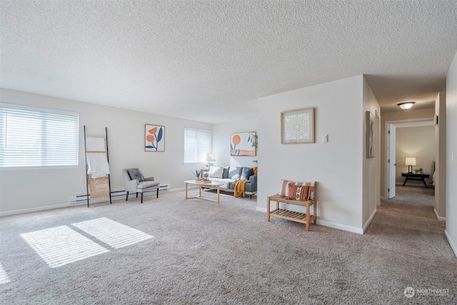 sitting room featuring a textured ceiling and light colored carpet