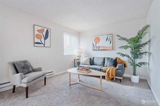 carpeted living room featuring a baseboard heating unit and a textured ceiling