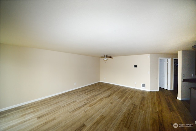 spare room featuring hardwood / wood-style flooring and ceiling fan