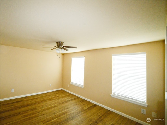 empty room featuring ceiling fan and wood-type flooring