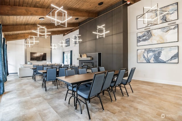 dining area featuring beamed ceiling, baseboards, high vaulted ceiling, and wood ceiling