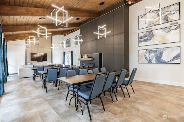 1111 Archwood Dr SW Unit 447, Olympia, WA 98502 - dining area with beam ceiling, a towering ceiling, a chandelier, wood ceiling, and baseboards