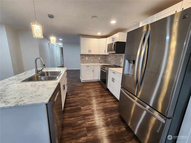 1111 Archwood Dr SW Unit 447, Olympia, WA 98502 - kitchen with tasteful backsplash, dark wood-style flooring, a sink, stainless steel appliances, and white cabinets