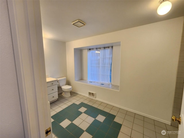 151 Rilla Ln, Sequim, WA 98382 - bathroom featuring toilet, tile patterned flooring, vanity, and baseboards