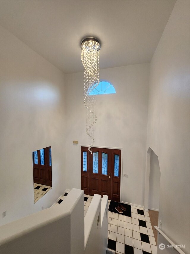151 Rilla Ln, Sequim, WA 98382 - entryway featuring a chandelier, a high ceiling, and tile patterned floors