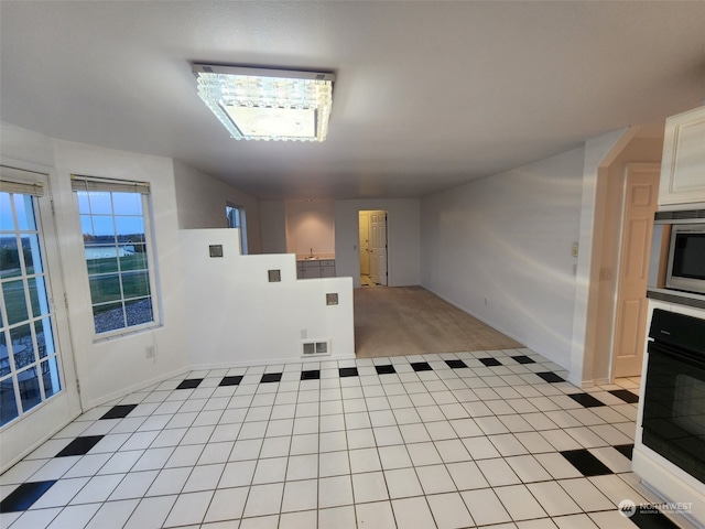 interior space with light tile patterned floors