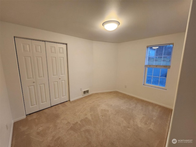 151 Rilla Ln, Sequim, WA 98382 - unfurnished bedroom featuring carpet floors, baseboards, and a closet