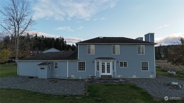 151 Rilla Ln, Sequim, WA 98382 - rear view of house with entry steps, a chimney, french doors, and a lawn