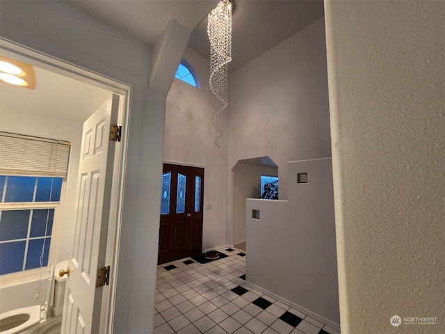 entryway with light tile patterned flooring