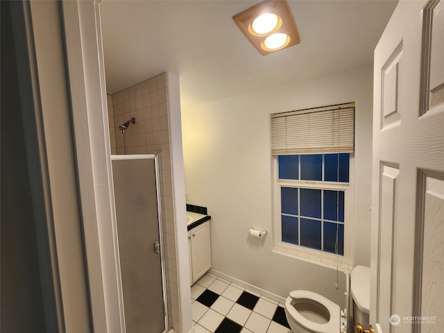 bathroom with walk in shower, vanity, and toilet