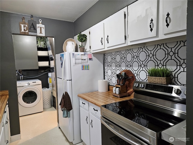 kitchen with washer / clothes dryer, butcher block countertops, stainless steel electric range, white cabinets, and white fridge