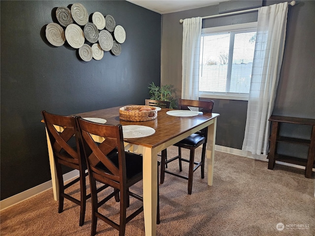 view of carpeted dining area