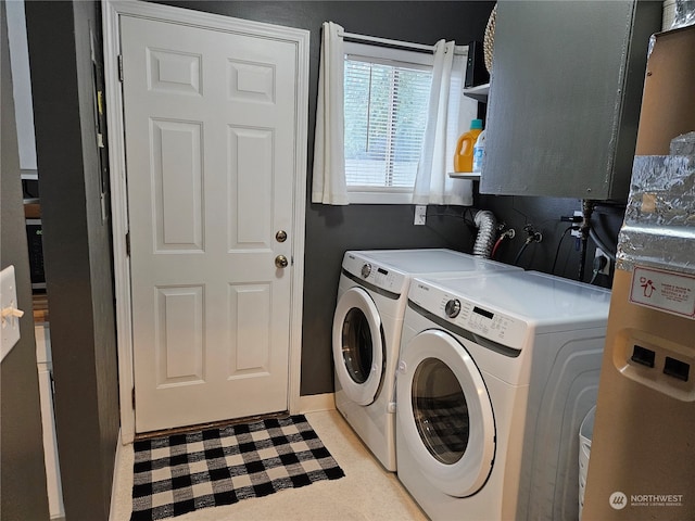 laundry room with separate washer and dryer