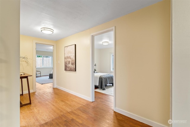 hall with light hardwood / wood-style floors