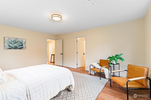 bedroom featuring wood-type flooring