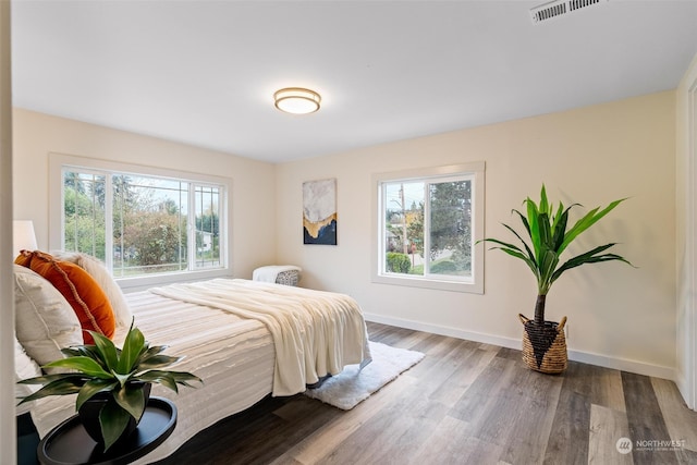 bedroom with hardwood / wood-style floors